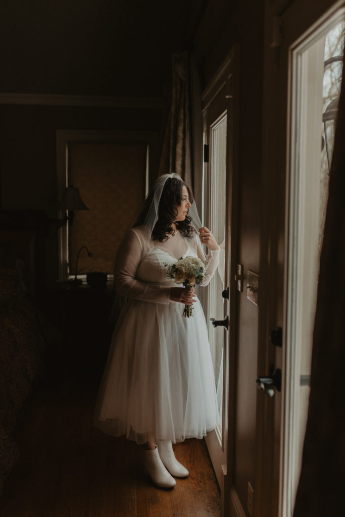 Bride getting ready in her bedroom before her elopement day