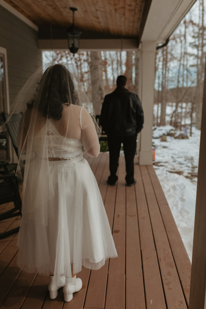 Bride and her father during their first look on a wedding day in the mountains 